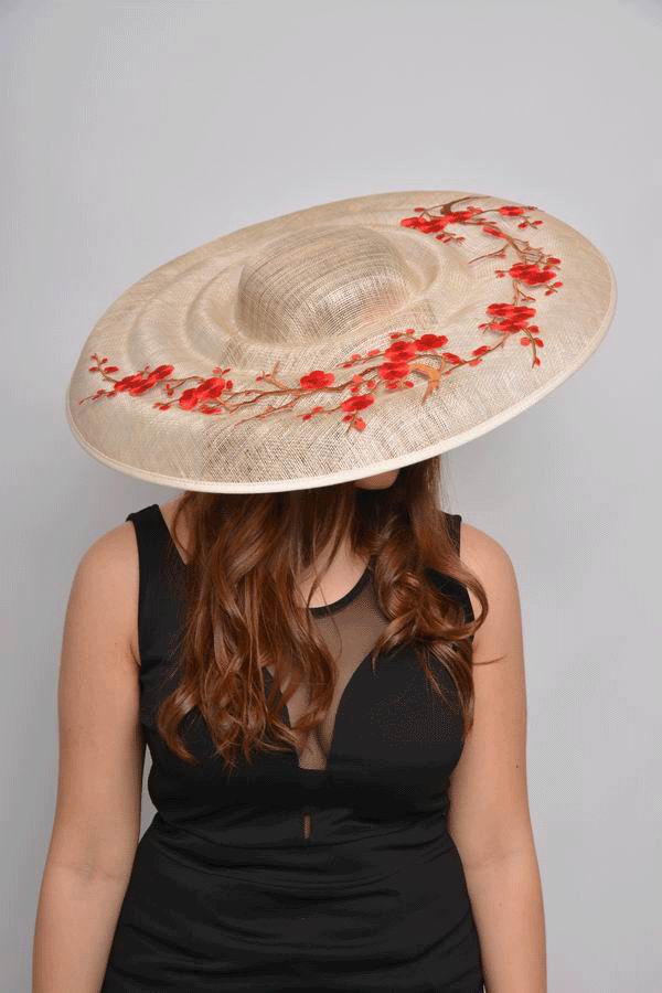 Sinamay Floppy Hat in Champagne decorated with Red Flowers. Romina