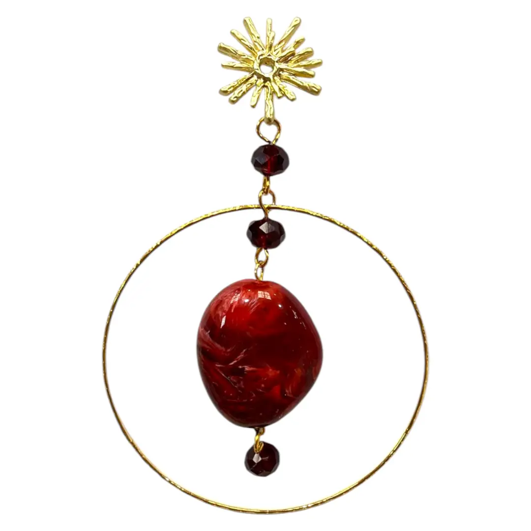 Burgundy flamenco earrings with a golden hoop and handcrafted design